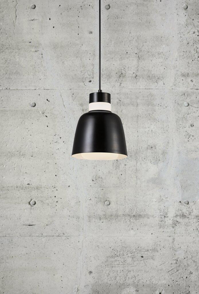 Emma 18 black pendant against concrete wall.