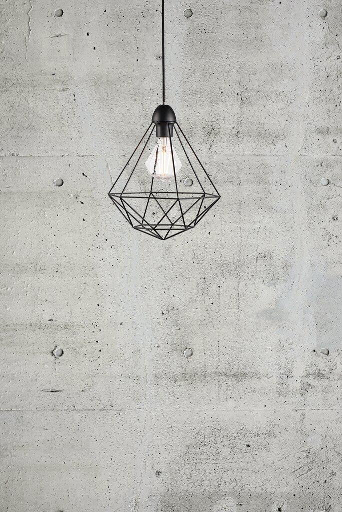 Tees pendant against concrete wall.